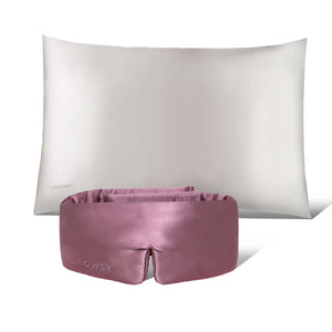 The drowsysleepco Perfect Skin Bundle Pink Damask Rose, featuring a white pillow and pink silk sleep mask embroidered with “Drowsy,” is elegantly displayed side by side on a plain white background for restful nights.