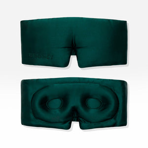 Two Ivy Green - Eyelash Protecting Masks by us.drowsysleepco are shown against a white background. One mask displays the exterior, featuring โDROWSYโ embroidery, while the other reveals the interior with contoured eyecups and a nose cutout designed for eyelash protection.
