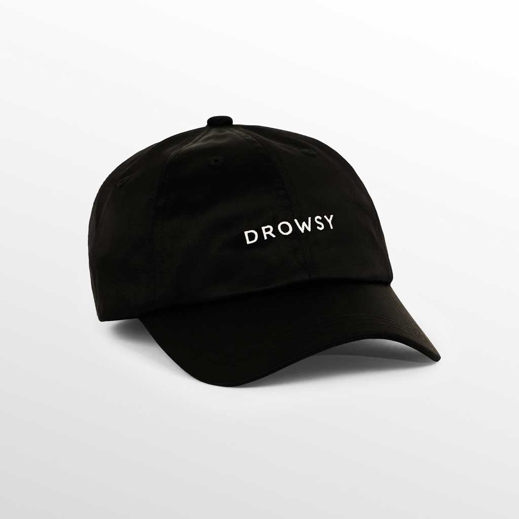 The Drowsy Silk Cap - Black Jade by Drowsy features DROWSY embroidered in white on the front, making it a stylish choice for outdoor workouts or sunny days. Shown against a plain white background.