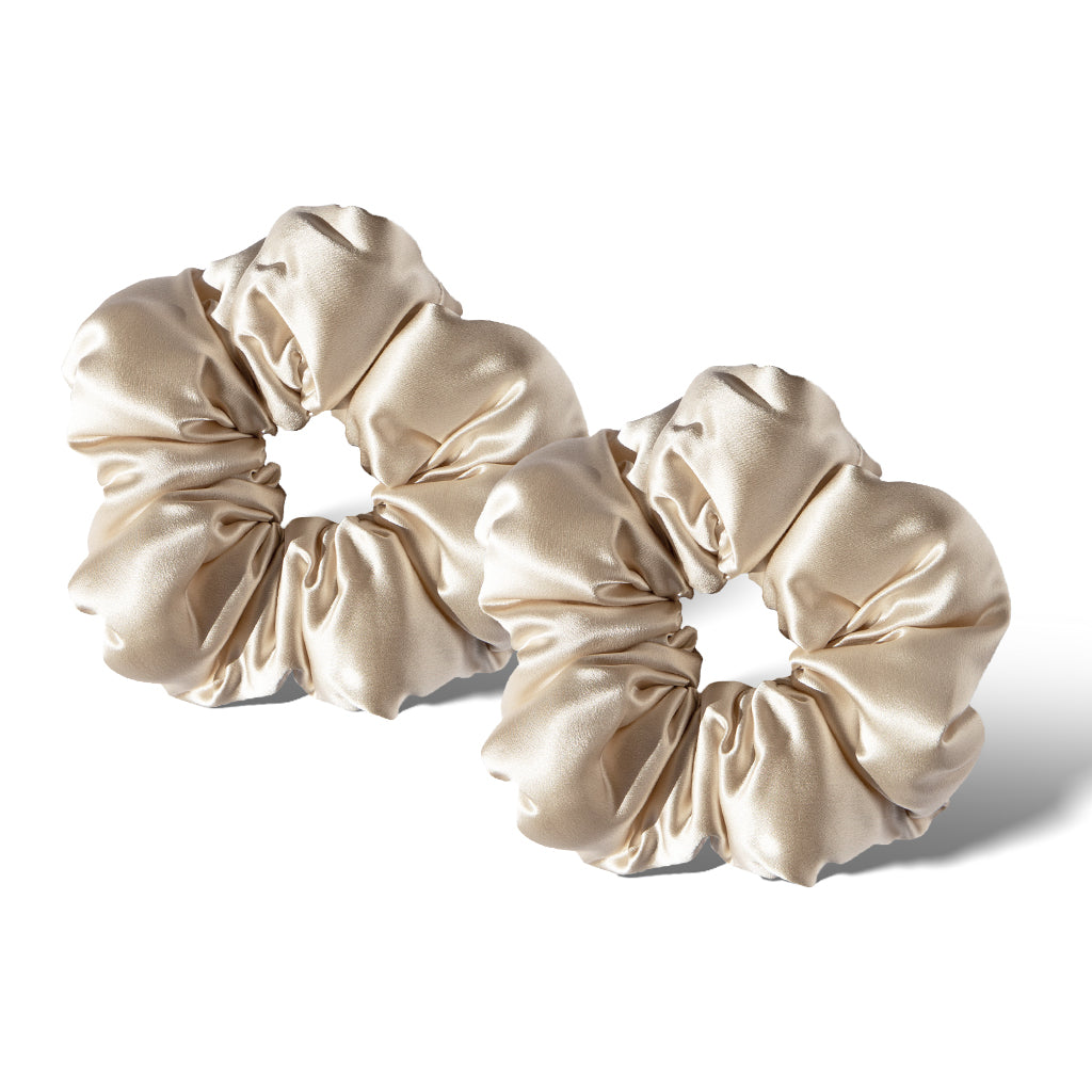 Two Dusty Gold - Padded Scrunchies by us.drowsysleepco are displayed side by side on a white background, offering a shiny satin beige look perfect as a stylish sleep hair accessory.