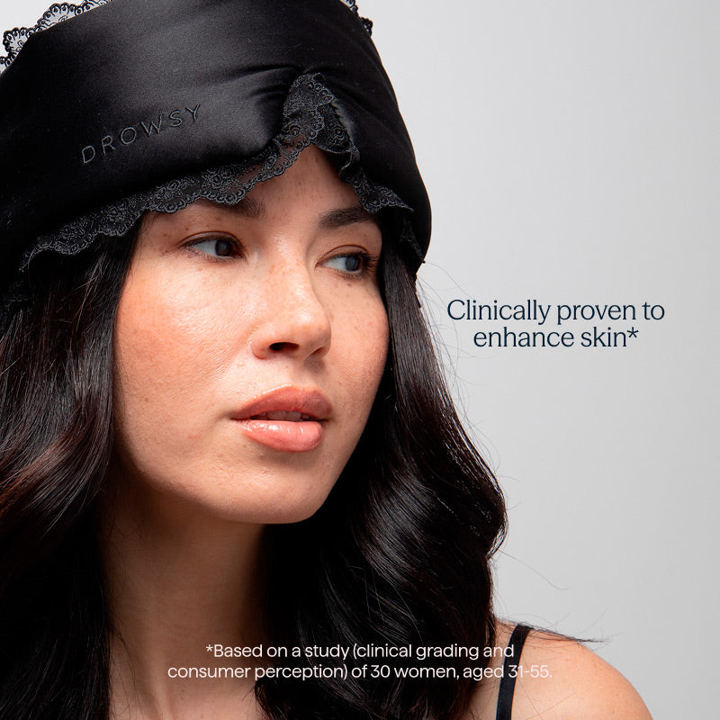 A woman wears the Paris Love Story - Black Jade Sleep Mask by drowsysleepco. Text: Clinically proven skincare to enhance skin.* Based on a study (clinical grading and consumer perception) of 30 women, aged 31-55.