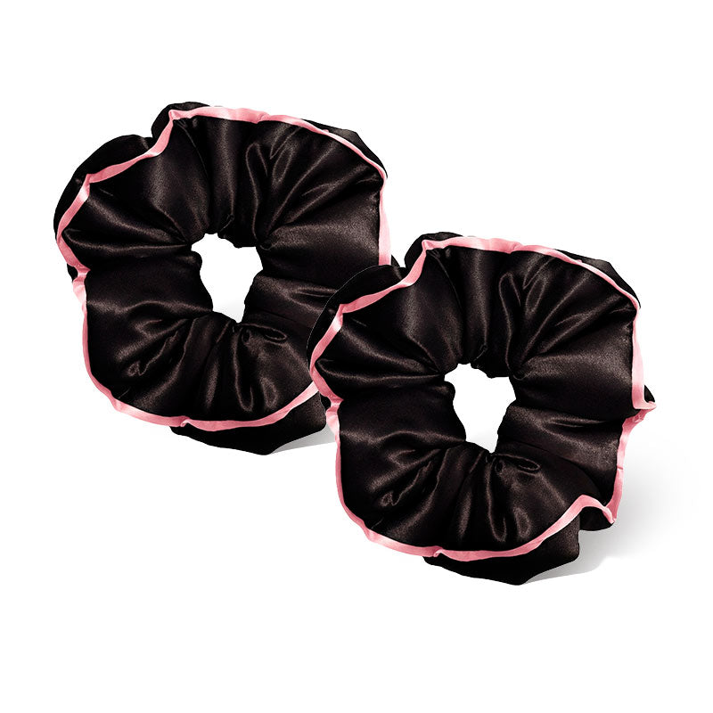 Two drowsysleepco Sleep and the City Black Padded Scrunchies are placed side by side on a white background, featuring black satin fabric with light pink edging.