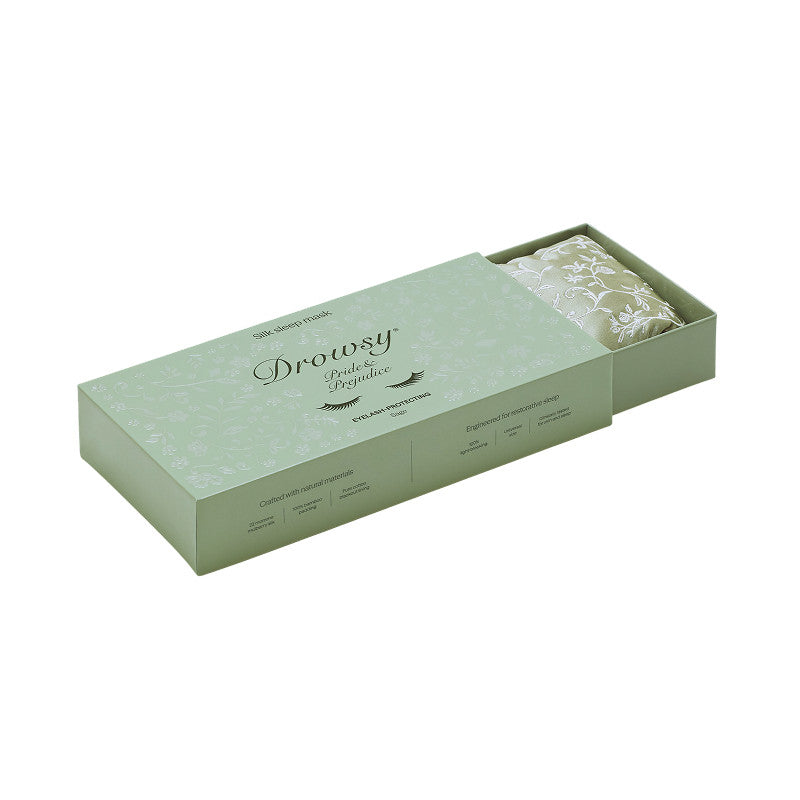 Sage green sliding gift box containing a folded floral print Pride & Prejudice - Sage + English Rose Eyelash Protecting Masks mulberry silk sleep mask.
