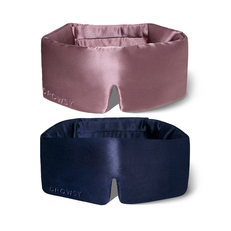 The drowsysleepco 2-Pack Sleep Masks in Midnight Blue and Damask Rose are shown on a white background, each with "DROWSY" embroidered on the side and a center notch for comfort—perfect for a Valentine’s gift.