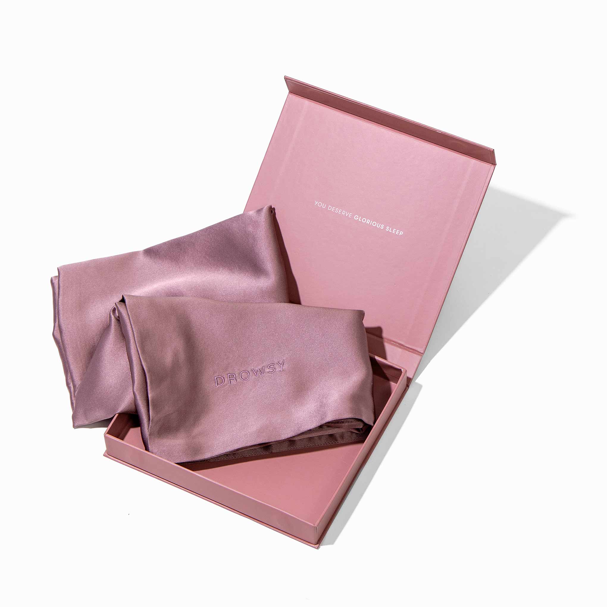 Pink pillowcase box opening with pink silk pillowcase inside