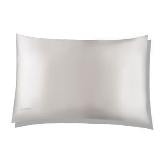 White coloured silk pillow case on white background