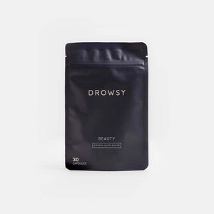 A minimalist black resealable pouch labeled Beauty Supplement Subscription by drowsysleepco contains 30 capsules. The packaging features white text on a plain light gray background.