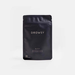 A black resealable pouch labeled drowsysleepco’s Sleep Supplement Subscription contains 30 capsules for sleep. The minimalist packaging is shown against a plain, light background.