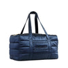 The Drowsy Silk Weekender - Midnight Blue is a quilted bag with double handles, gold zipper, and Drowsy branding—ideal for your travel essentials.