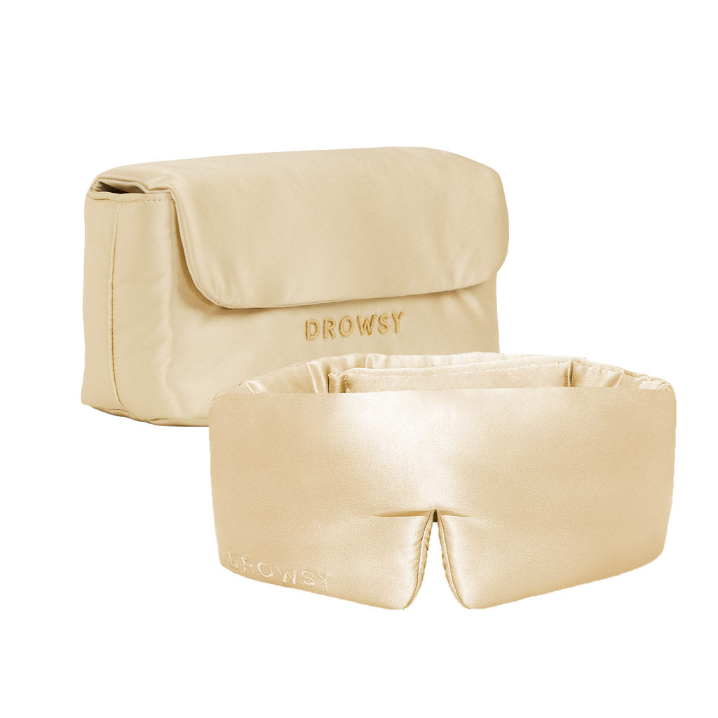 The Drowsy Sleepover bundle in Dusty Gold features a smooth, satin-like sleep mask and a matching pouch, both embroidered with the Drowsy brand name.