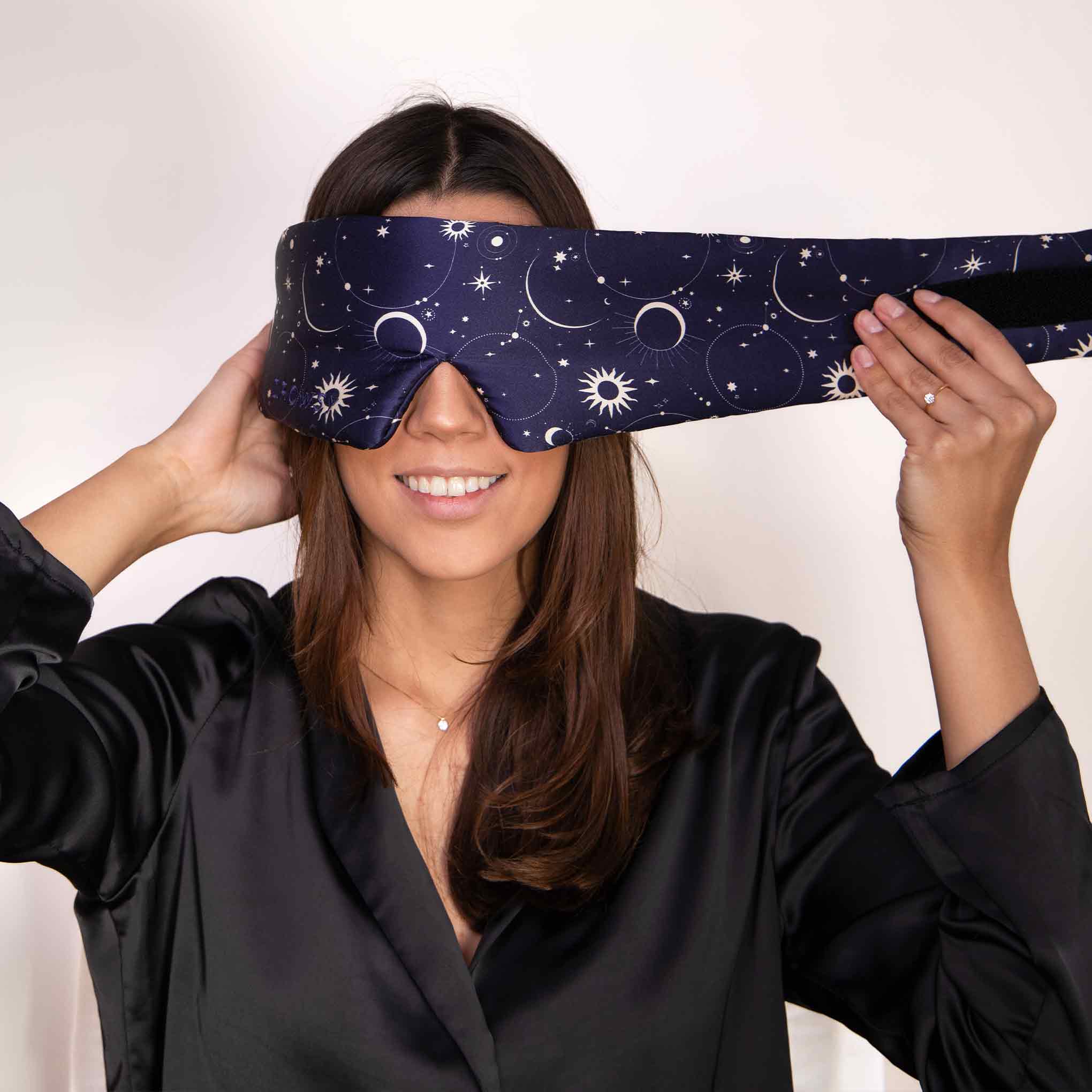 Drowsy-Sleep-Co.-Cosmic-Energy-Sleep-Mask-with-model2.jpg__PID:207d6c2f-449e-4cc8-82c7-19560c140853