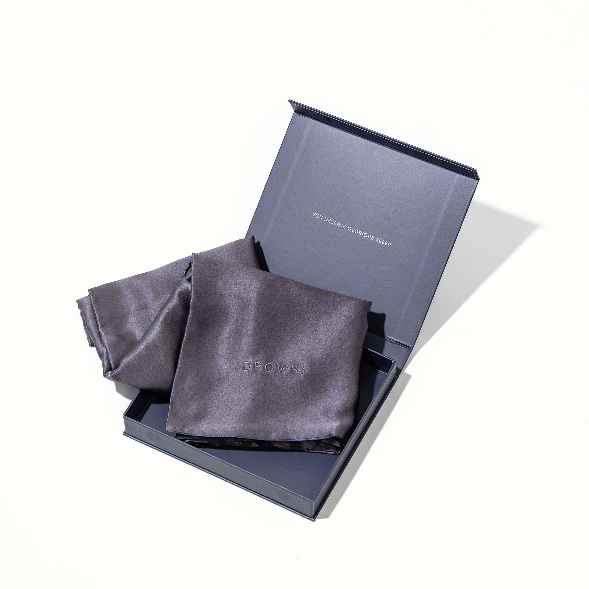 Grey pillowcase box opening with grey silk pillowcase inside