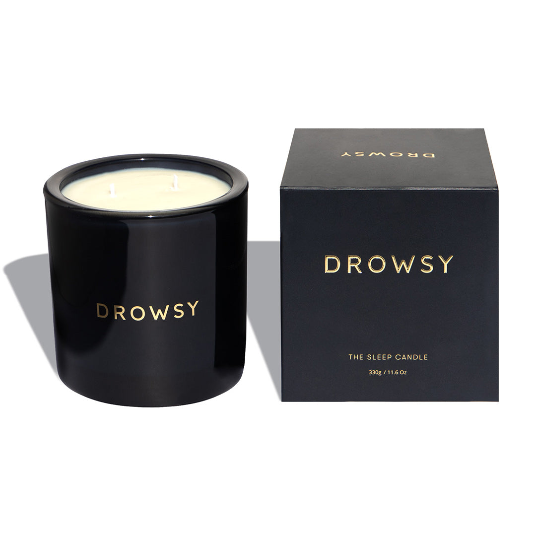 Drowsy-Sleep-Co.-Sleep-Candle-Blue-Glass-And-Box-On-White-Background