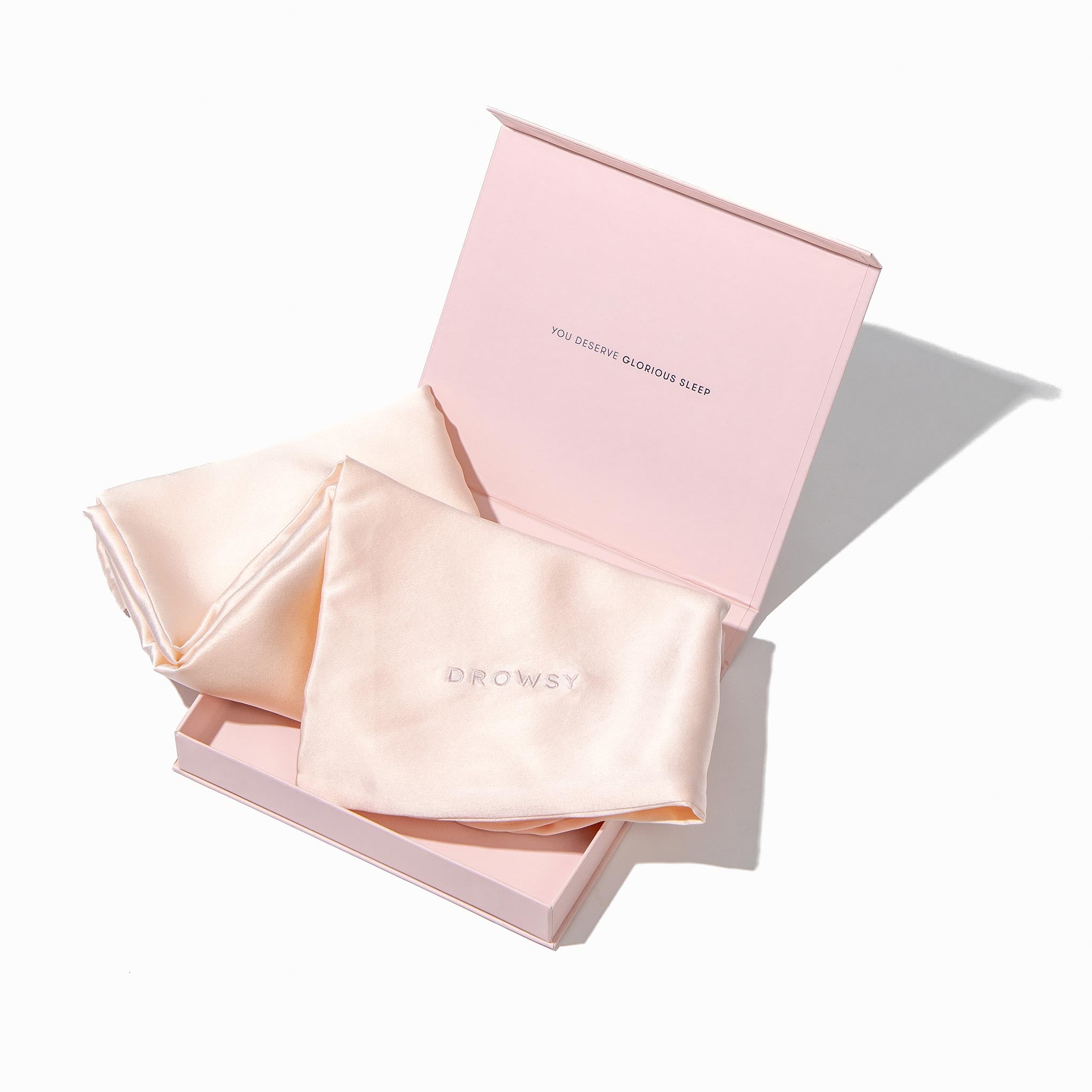 Pink pillowcase box opening with pink silk pillowcase inside