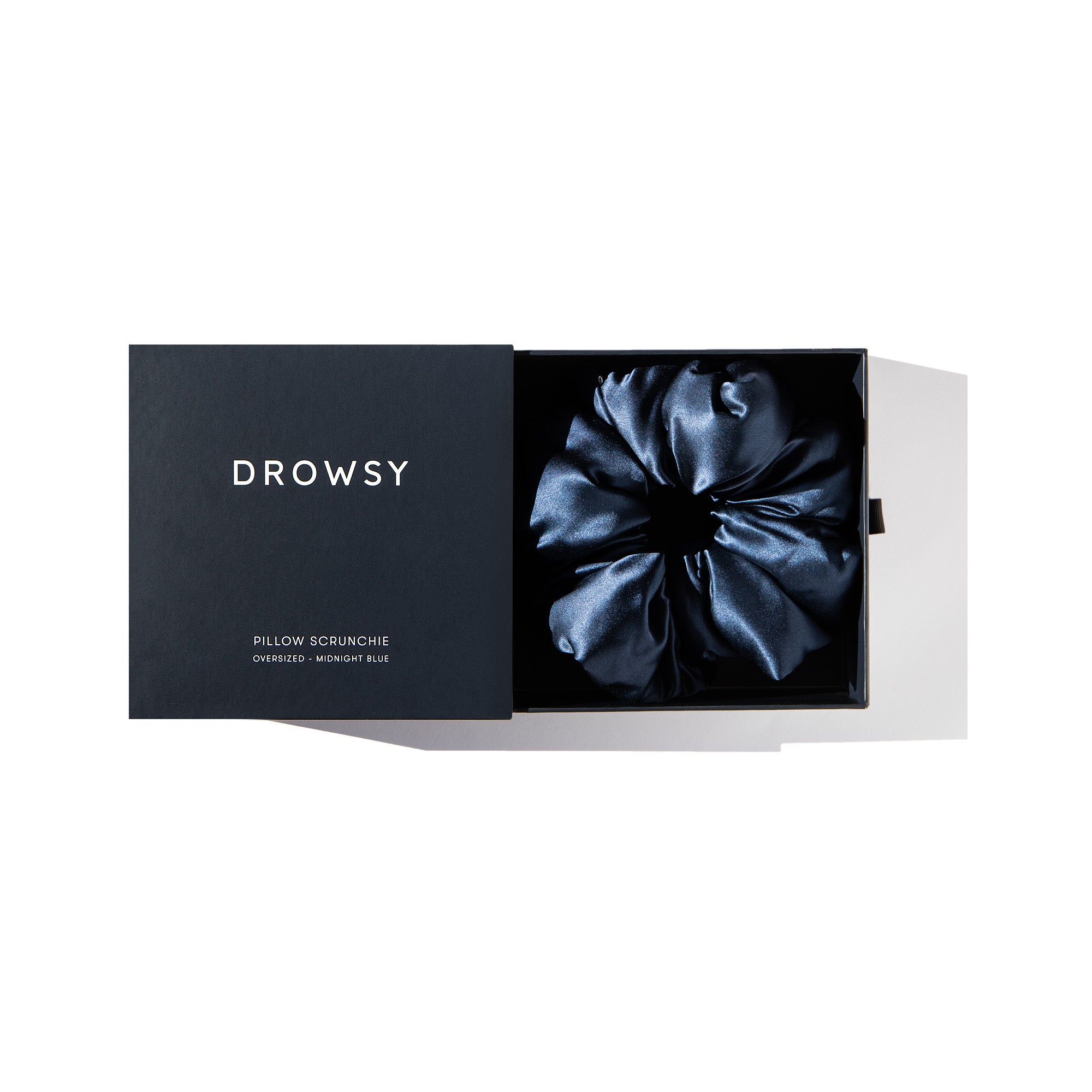 Drowsy Midnight Blue Pillow Scrunchie in its box on a white background
