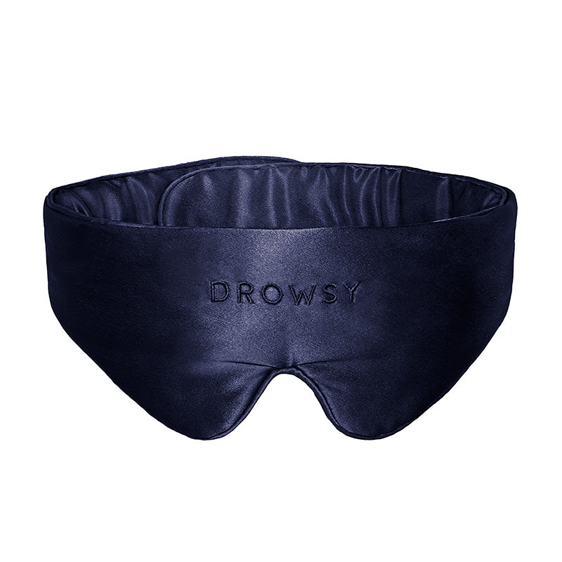 Introducing the Featherweight Silk Eye Mask in Midnight Blue by us.drowsysleepco—a luxurious, padded sleep mask crafted from mulberry silk. This dark blue eye mask is designed for ultimate comfort, with 
