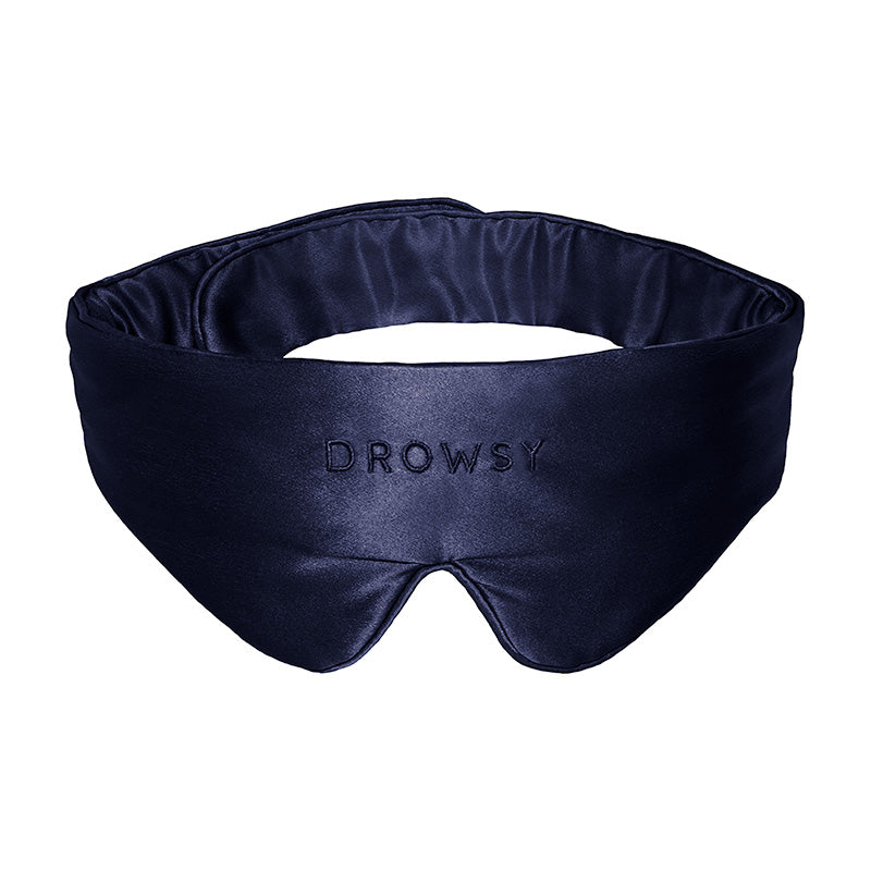 The Featherweight Silk Eye Mask in Midnight Blue by us.drowsysleepco is crafted from luxurious mulberry silk and features 