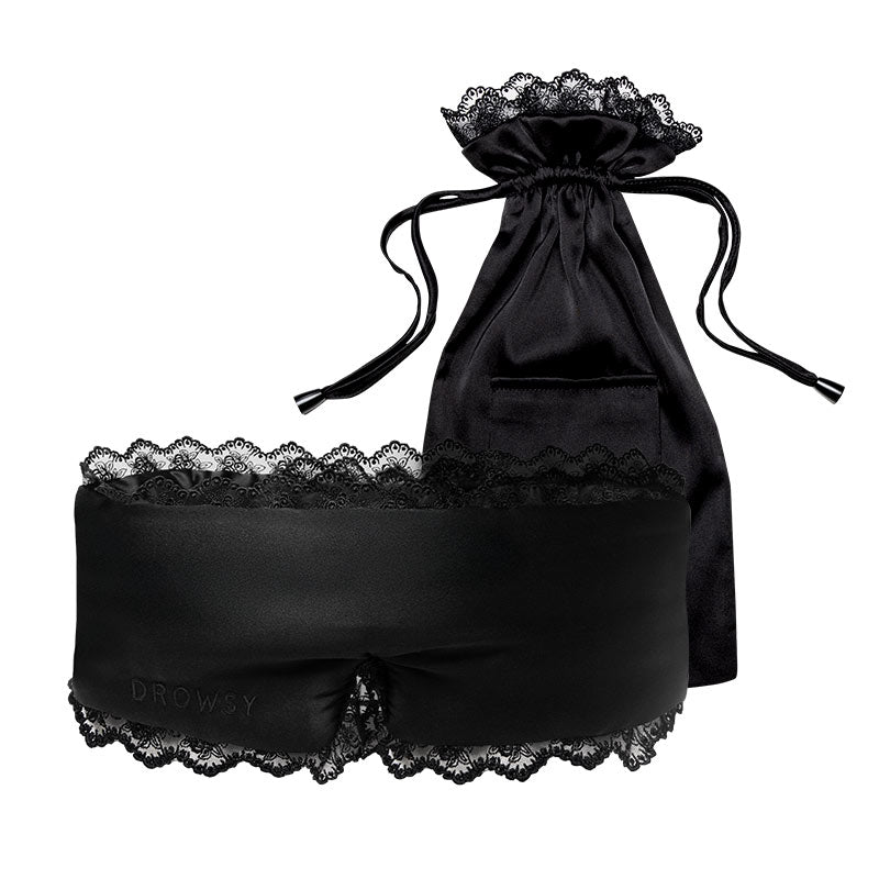 The drowsysleepco Paris Love Story - Black Jade Sleep Mask, featuring lace trim and DROWSY embossed, is shown with its matching black pouch, both displayed against a white background.