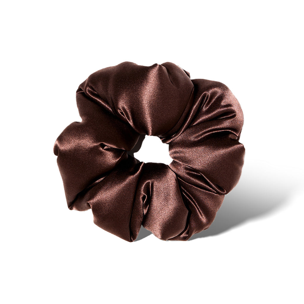 The us.drowsysleepco Cocoa Glow - Padded Scrunchie, an oversized silky hair sleep accessory, is displayed in a circular shape on a white background, featuring shiny dark brown satin and soft, voluminous gathers.
