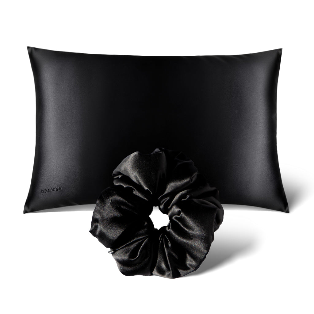 The Perfect hair bundle Black Jade by drowsysleepco features a black silk pillowcase paired with a matching silk scrunchie, both elegantly displayed against a crisp white background.