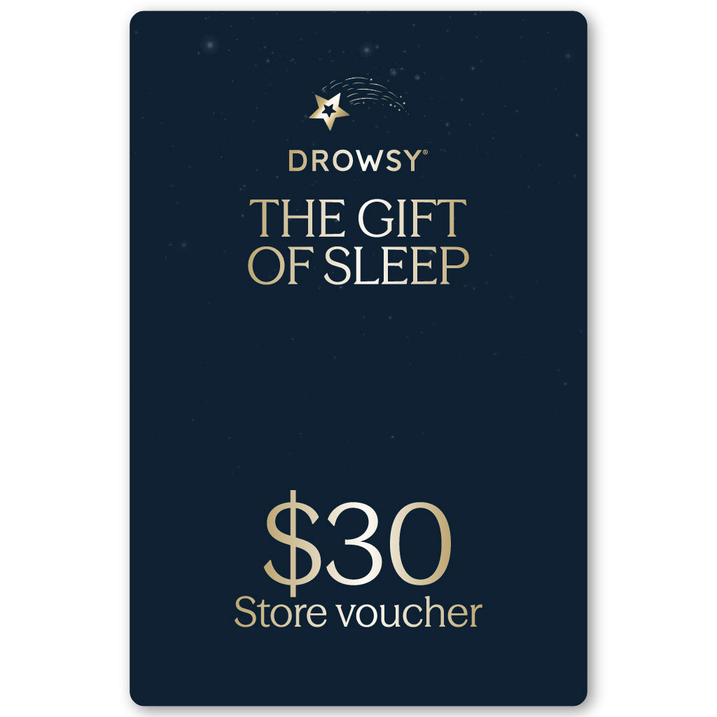 A dark blue Drowsy Sleep Co. Gift Card by us.drowsysleepco, featuring gold "The Gift of Sleep" text, $30 store voucher beneath, and decorated with small stars plus a shooting star at the top.