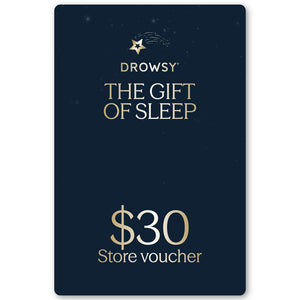 A dark blue Drowsy Sleep Co. Gift Card by us.drowsysleepco, featuring gold "The Gift of Sleep" text, $30 store voucher beneath, and decorated with small stars plus a shooting star at the top.