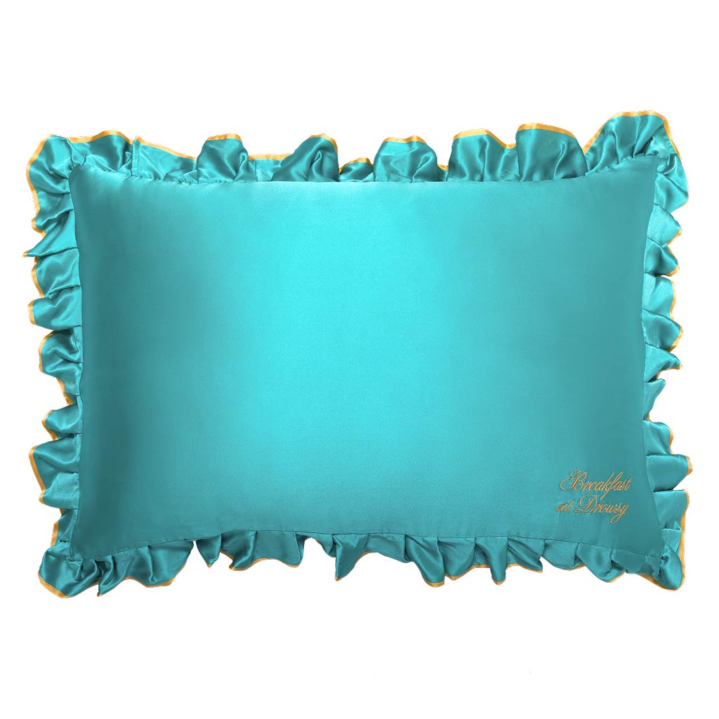 The drowsysleepco Breakfast at Drowsy - Turquoise Pillowcase is a rectangular teal satin cover with ruffled edges, gold trim, and "Breakfast at Drowsy" embroidery. It's hair protecting, anti sleep crease, shown on a white background.