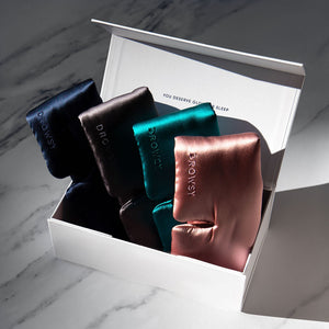 white gift box with 4 drowsy sleep masks inside