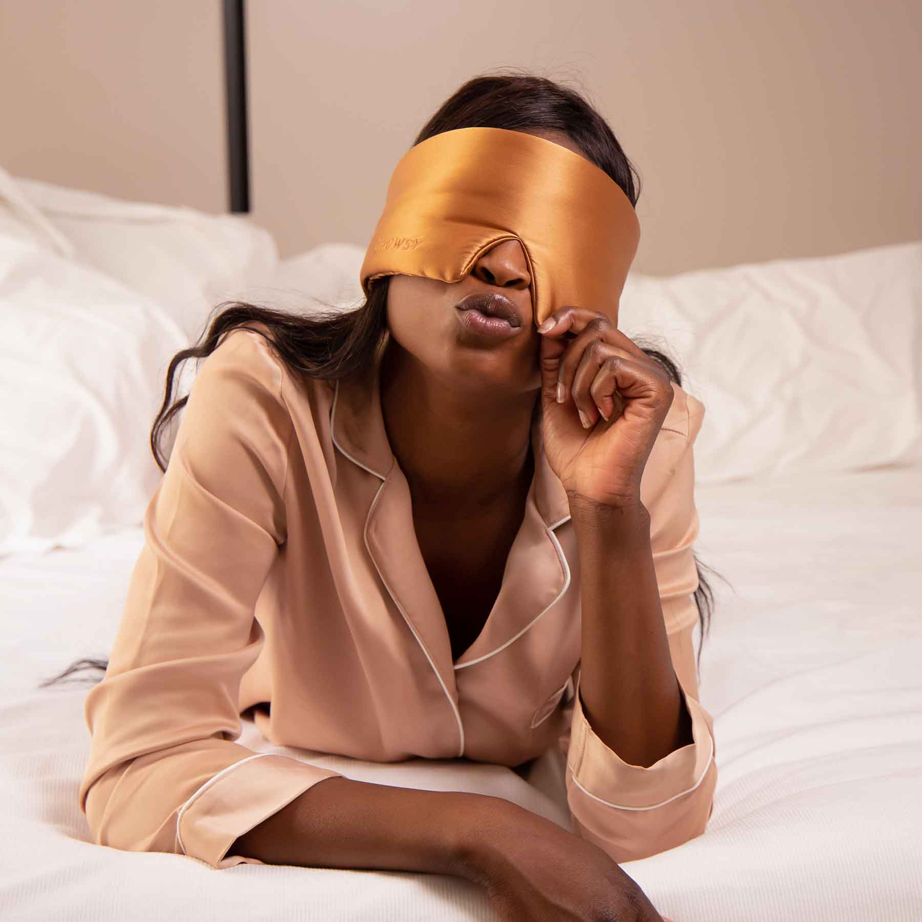 Model with Tuscan Kiss coloured Drowsy Sleep Co Mask covering her eyes